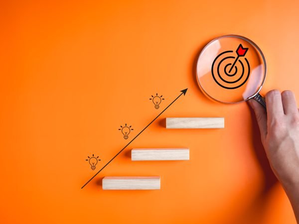 Target and light bulb icons on wooden blocks, Business growth success process, Business achievement goal and target, Planning and development for corporation